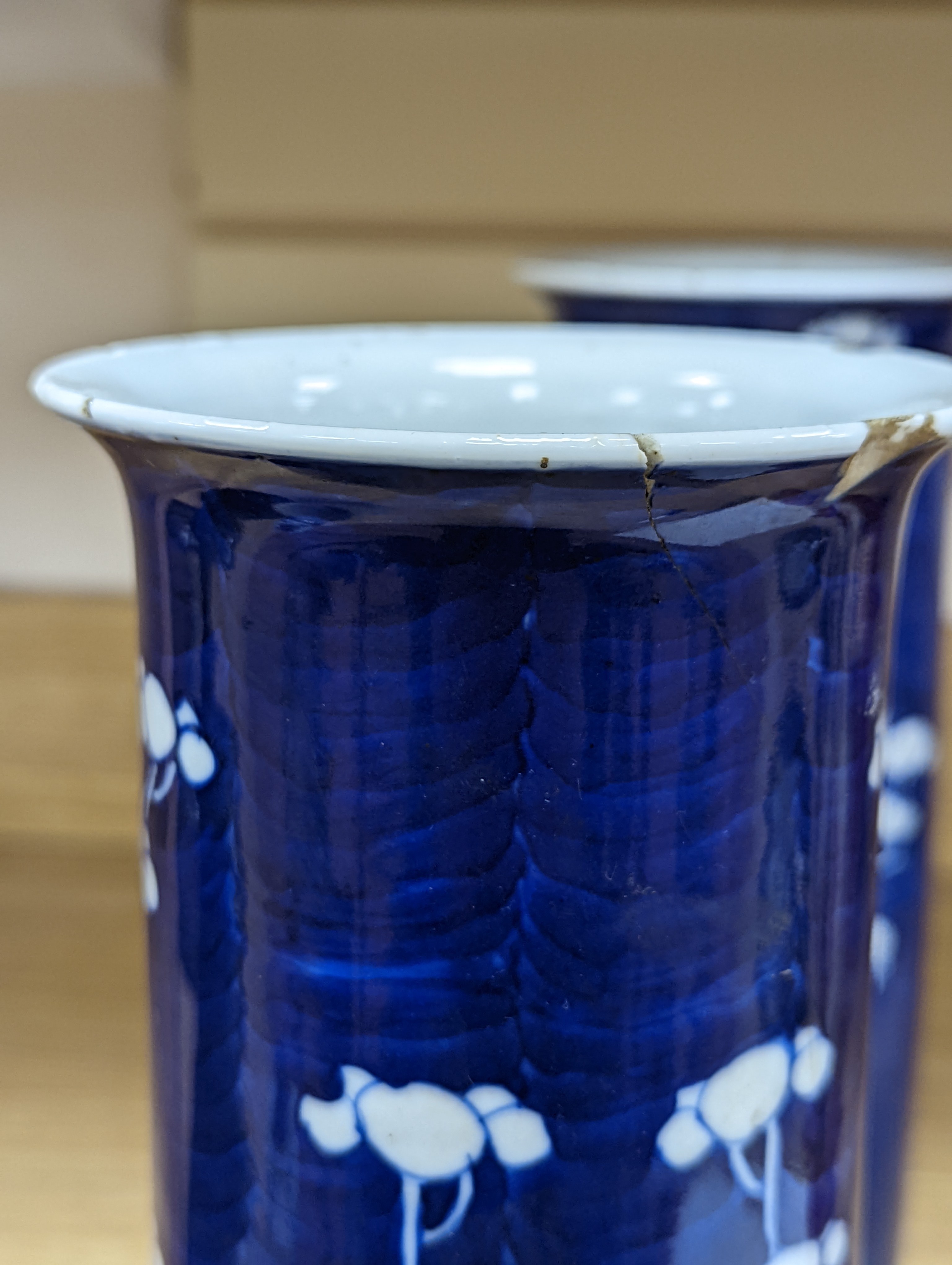An 18th century Chinese famille rose mug, a Chinese Imari tea caddy and two Chinese blue and white sleeve vases 30cm (4)